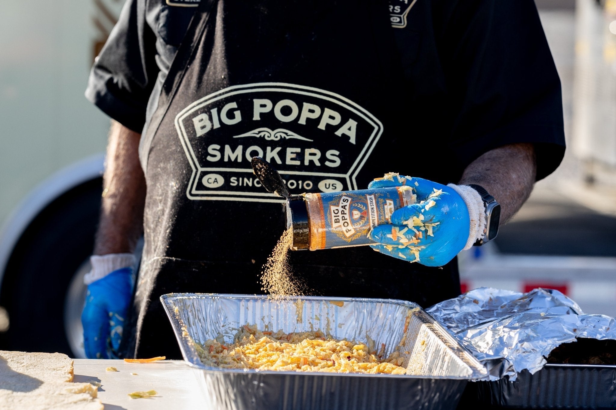 Close-up of Big Poppa's Seasoning label highlighting hand-crafted, locally-sourced ingredients and 12oz packaging details