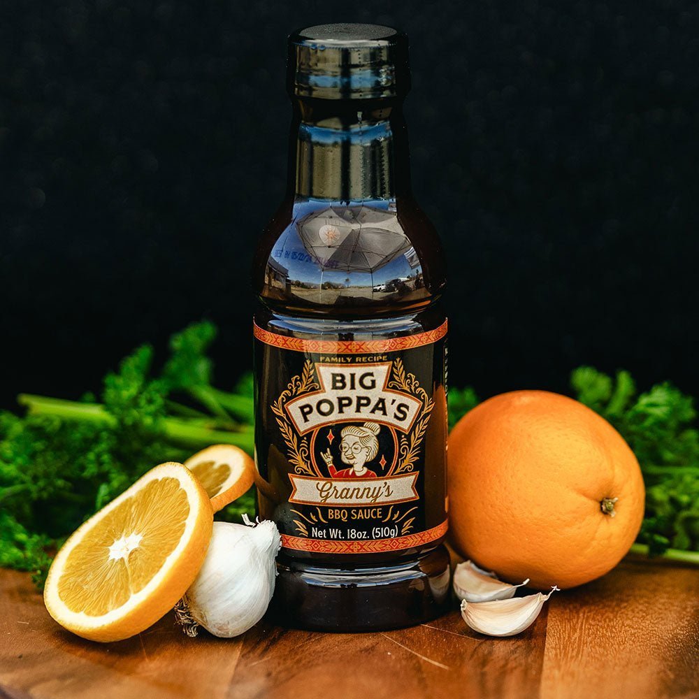 Close-up of Big Poppa's Granny's BBQ Sauce label highlighting handcrafted ingredients and rustic texture on the glass bottle.