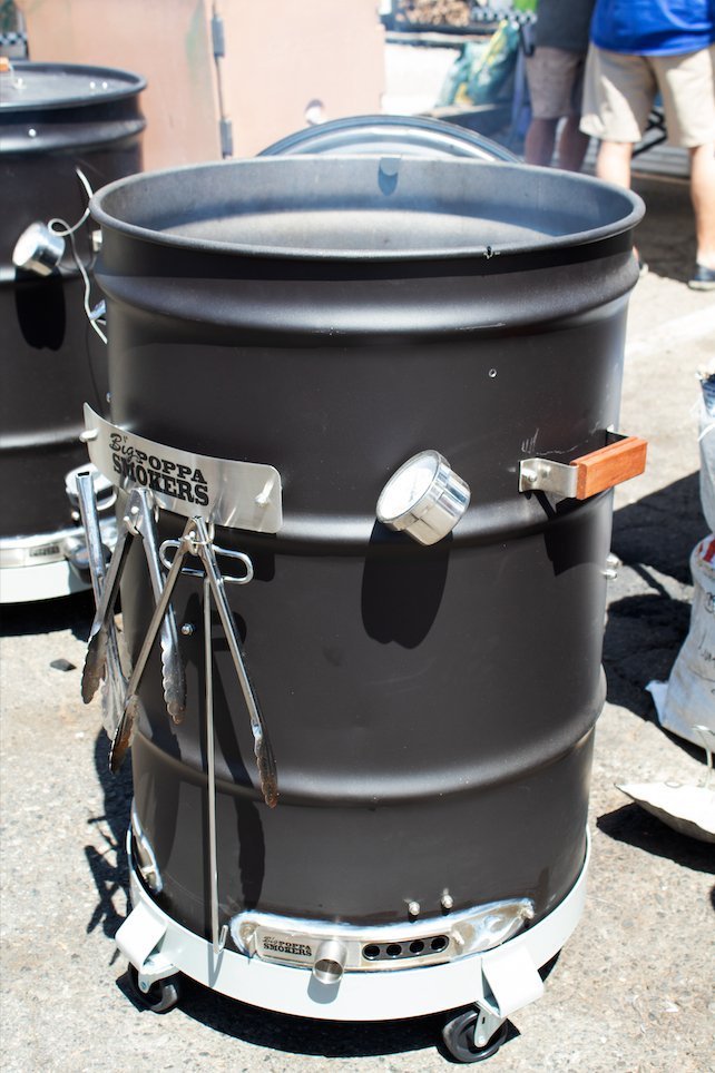Close-up of the BPS Carbon Drum Smoker Kit's textured black carbon fiber surface and detailed ventilation holes from a
