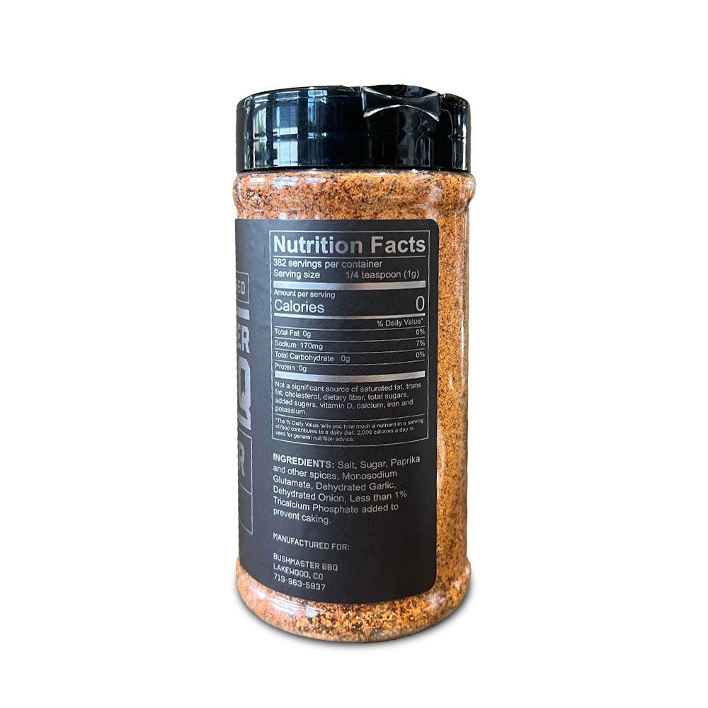 Close-up of the Bushmaster BBQ Brawler 13.5oz jar showing textured seasoning blend and hand-crafted labels with