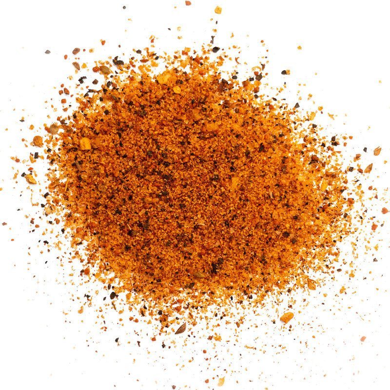 Close-up of the Clark Crew BBQ Jack'd Brisket Rub 12oz label highlighting hand-crafted, farm-raised ingredients and vibrant