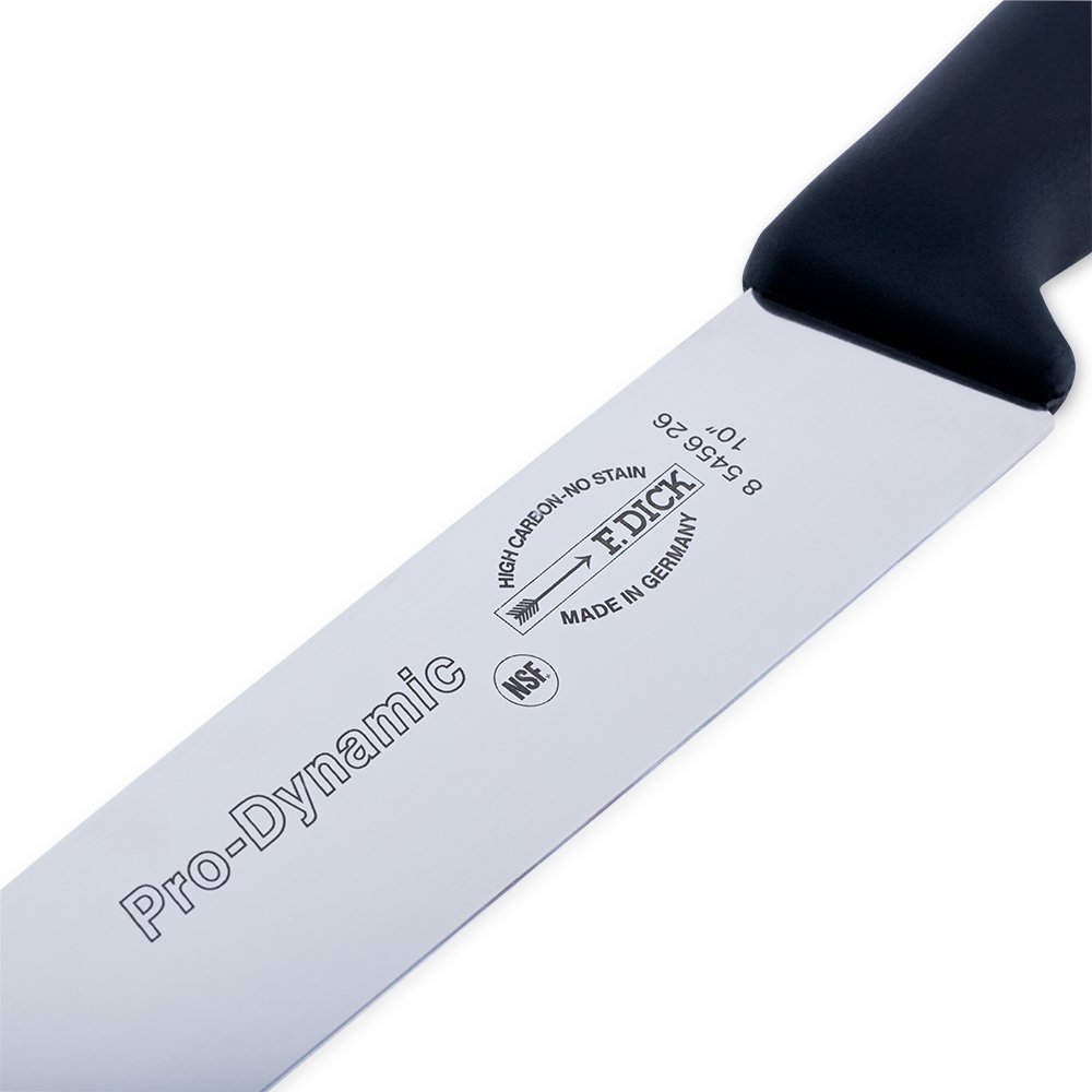 Close-up of the 10-inch stainless steel blade edge showcasing fine serrations and textured surface detail from a slightly