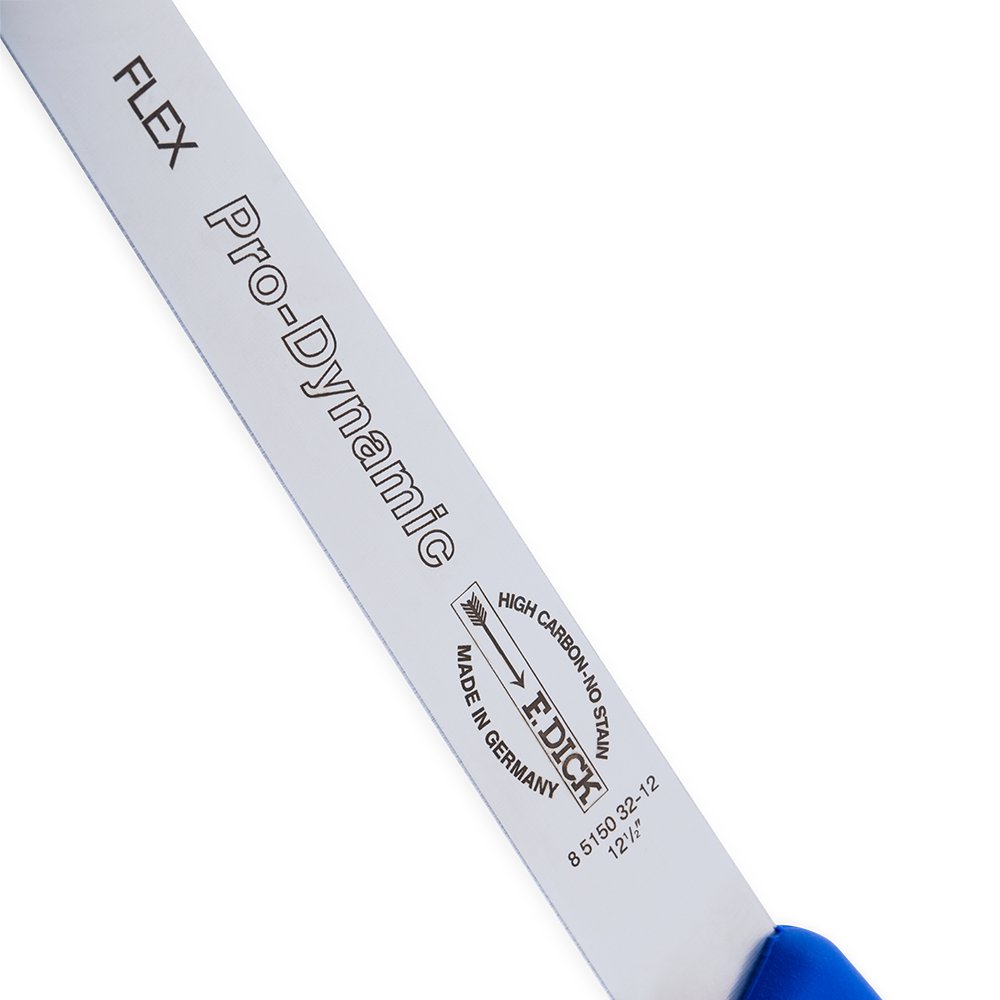 Close-up of the blue handle's textured grip and engraved F. Dick logo on the salmon/ham slicer blade edge.