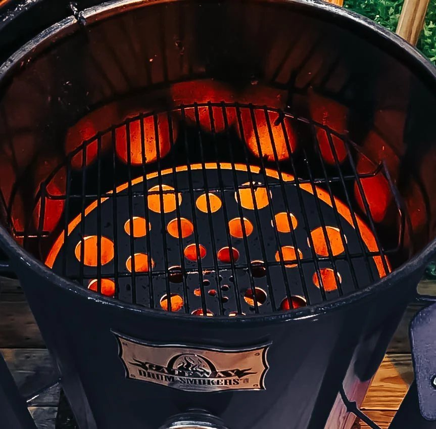 Close-up of the Gateway Mini Go2 Drum Smoker’s textured stainless steel lid handle with engraved branding and heat-resistant
