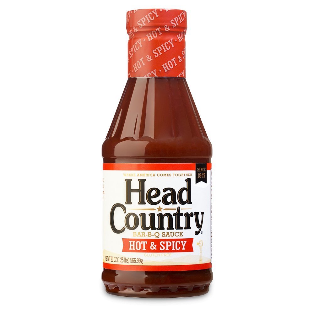 Head Country Hot BBQ Sauce 20oz bottle with orange-red glossy glass and black plastic cap, textured label featuring bold