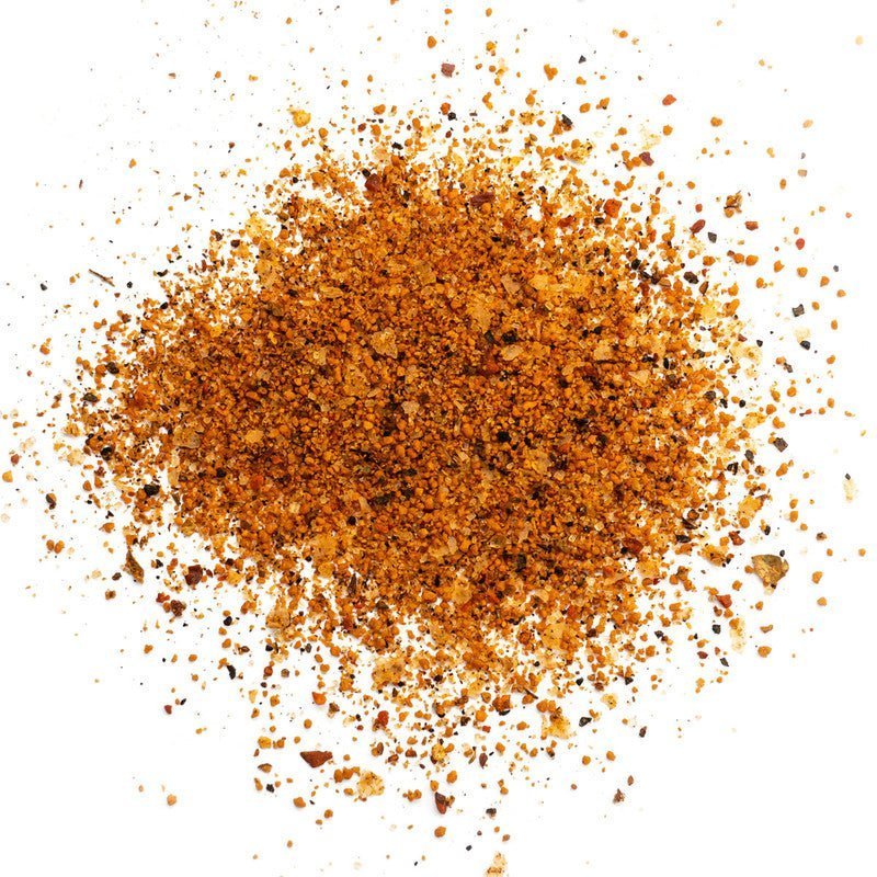 Close-up of the Heavy Smoke White Label Rub 11oz jar showing textured seasoning granules and rustic label detail from an