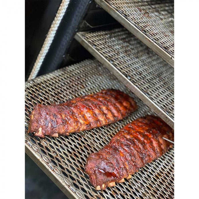 Close-up of the black textured stainless steel lid latch on Humphrey's BBQ Qube'd Box GEN23 smoker showing precise metal
