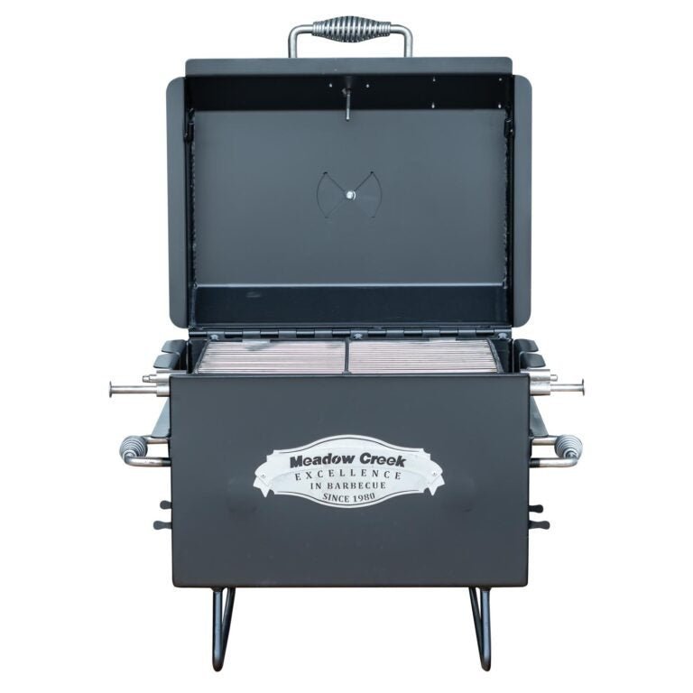 Close-up of the Meadow Creek BBQ18 Chicken Cooker's stainless steel lid handle and textured surface detail from a top-front