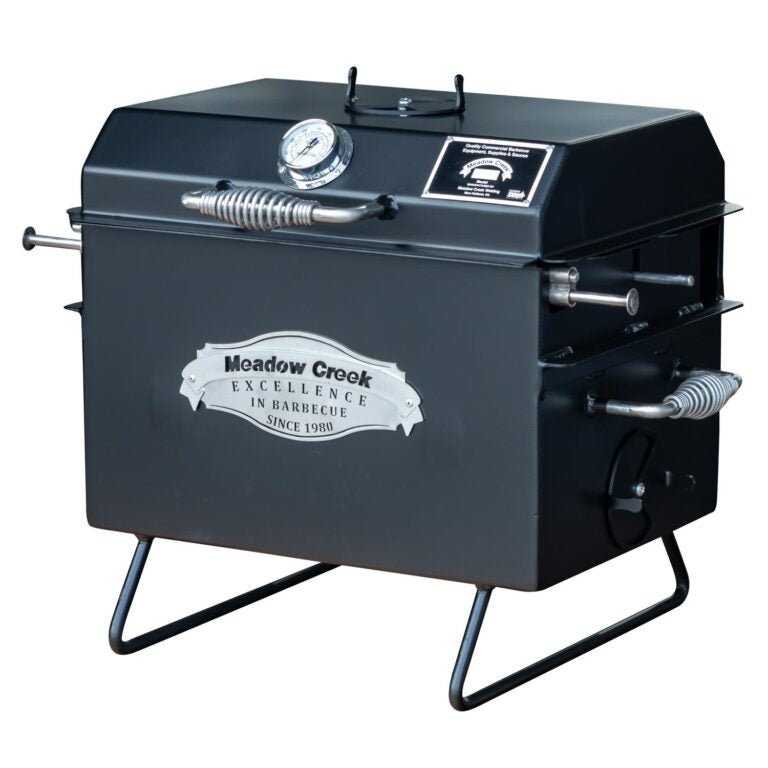 Close-up of the Meadow Creek BBQ18 Chicken Cooker’s vented lid with metal rivet details and textured black finish.