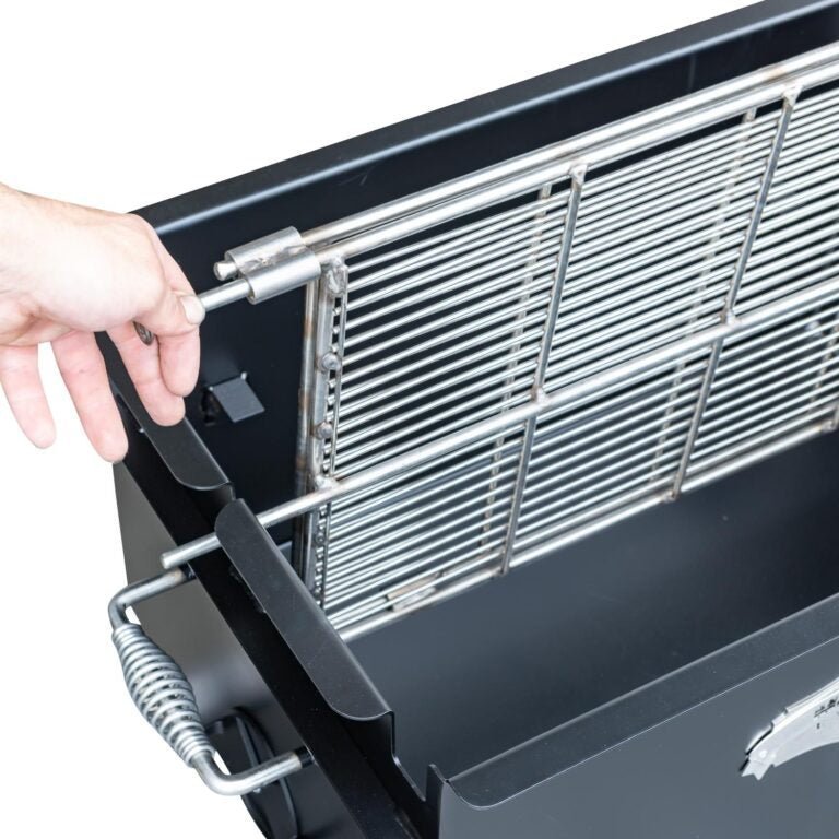 Close-up of the Meadow Creek BBQ26 Chicken Cooker’s stainless steel grate with textured surface and drip tray edges visible