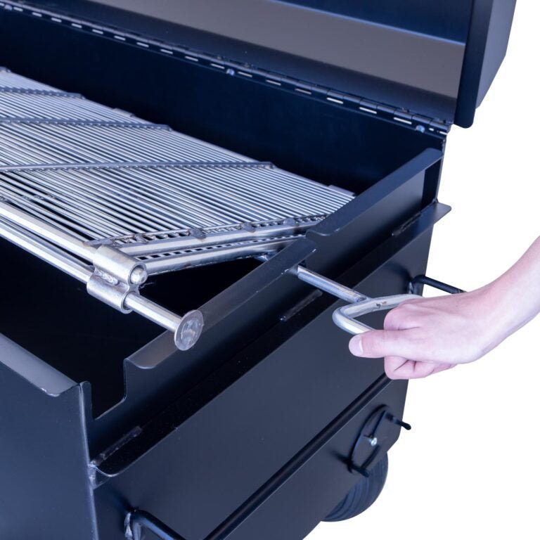 Close-up of the Meadow Creek BBQ42 Chicken Cooker’s stainless steel lid latch and textured handle for secure grip during use.