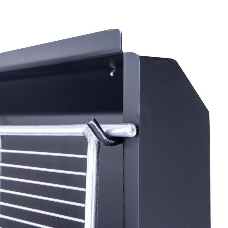 Close-up of the Meadow Creek BBQ42 chicken cooker’s stainless steel lid handle and textured surface on the cooking chamber