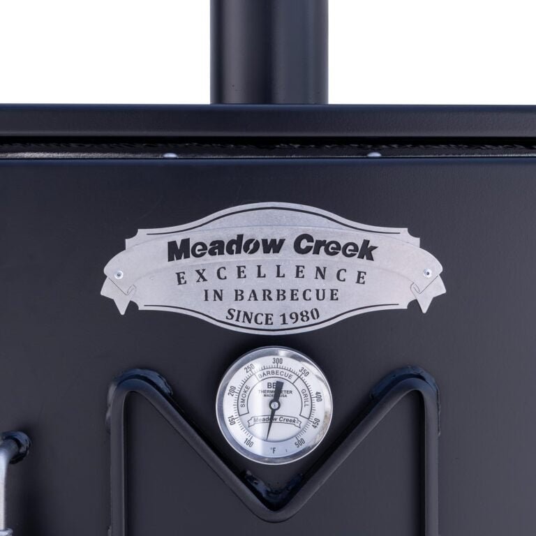 Close-up of the stainless steel lid latch and textured surface of the Meadow Creek BX25 Cabinet Smoker’s top panel.