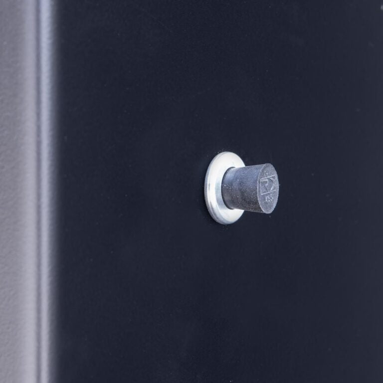 Close-up of the Meadow Creek BX25 cabinet smoker's black steel door latch and textured surface, highlighting durable