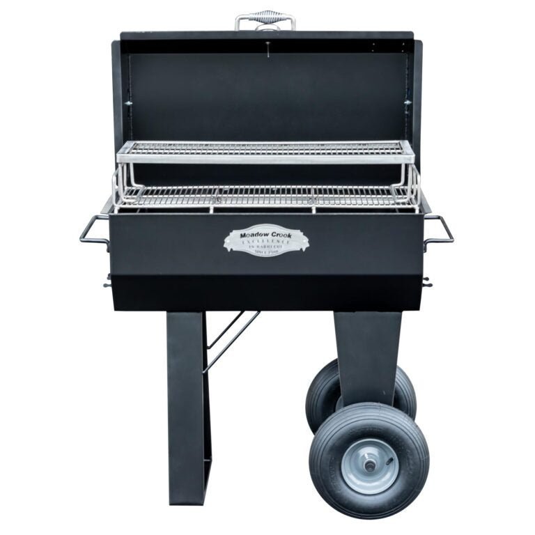 Close-up of the Meadow Creek PR36 Pig Roaster’s stainless steel heat diffuser with perforated surface for even heat