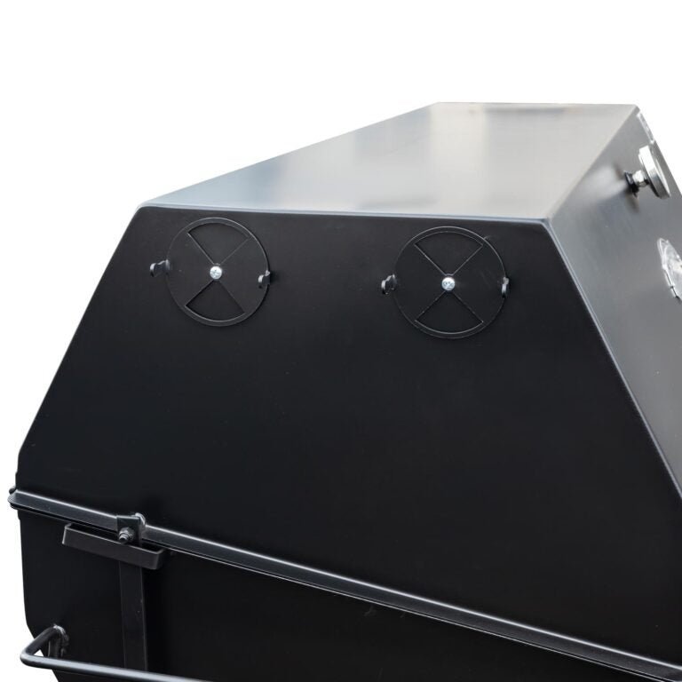 Close-up of the polished stainless steel lid handle and textured surface of the Meadow Creek PR60 Pig Roaster showing its