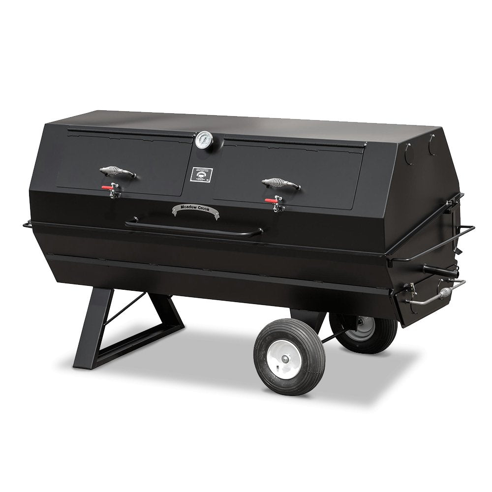 Close-up of the cylindrical firebox lid with adjustable air vent on Meadow Creek PR72 pig roaster, showcasing textured steel