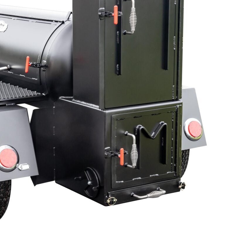 Close-up of the stainless steel latch and textured black finish on the Meadow Creek TS120 offset smoker trailer door side