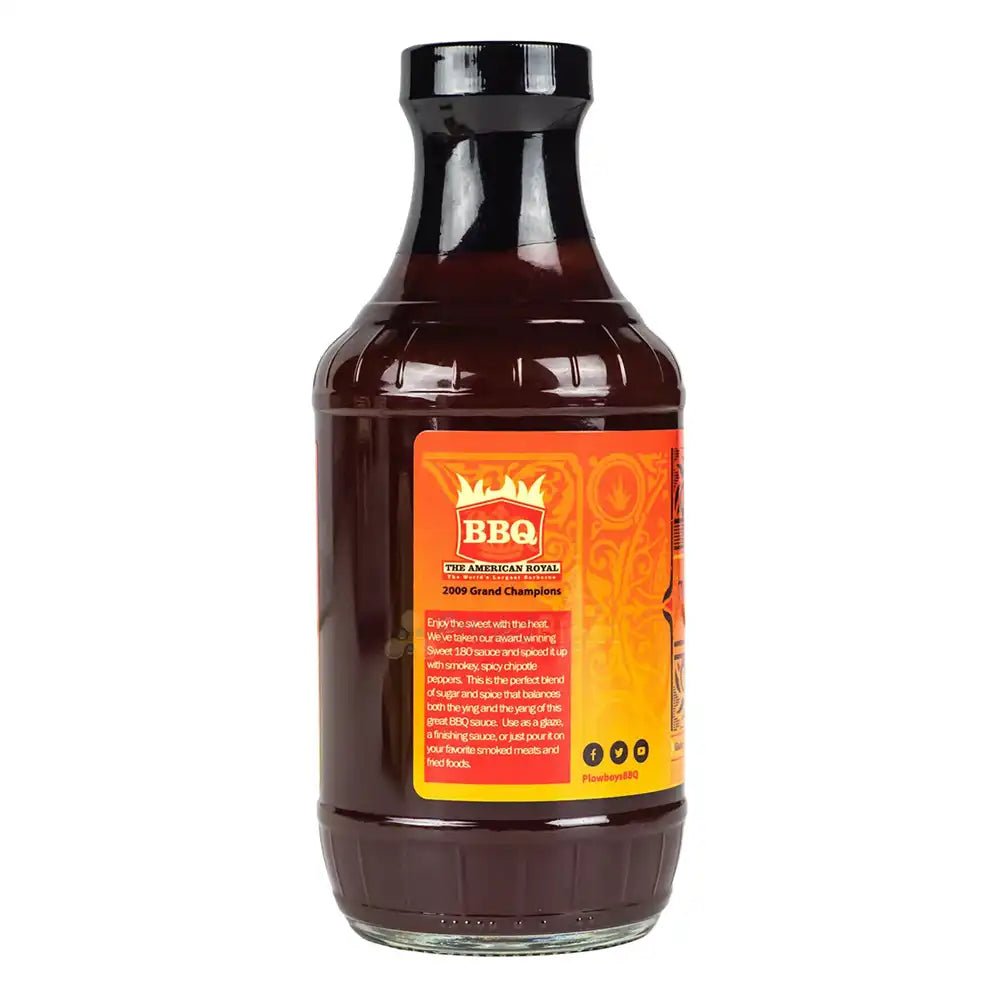 Close-up of the vibrant red sauce pouring from the bottle's spout, highlighting its thick, glossy texture and rich seasoning