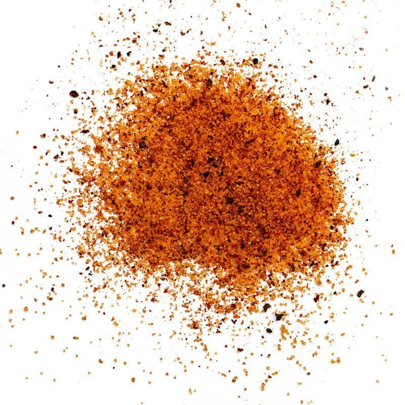 Close-up of the 14oz Yardbird Rub container label highlighting bold black and white text with orange accents and textured
