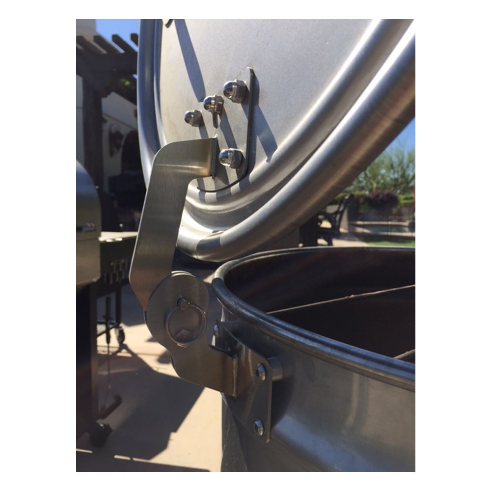 Close-up of the black metal hinge pin and textured surface on the BBQ drum smoker lid from a lower angle, highlighting