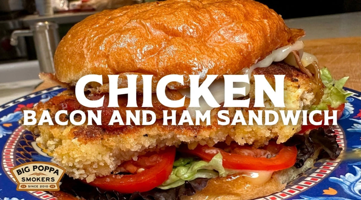 Crispy chicken, bacon and ham sandwich with melted cheese, lettuce and tomato on a toasted bun.