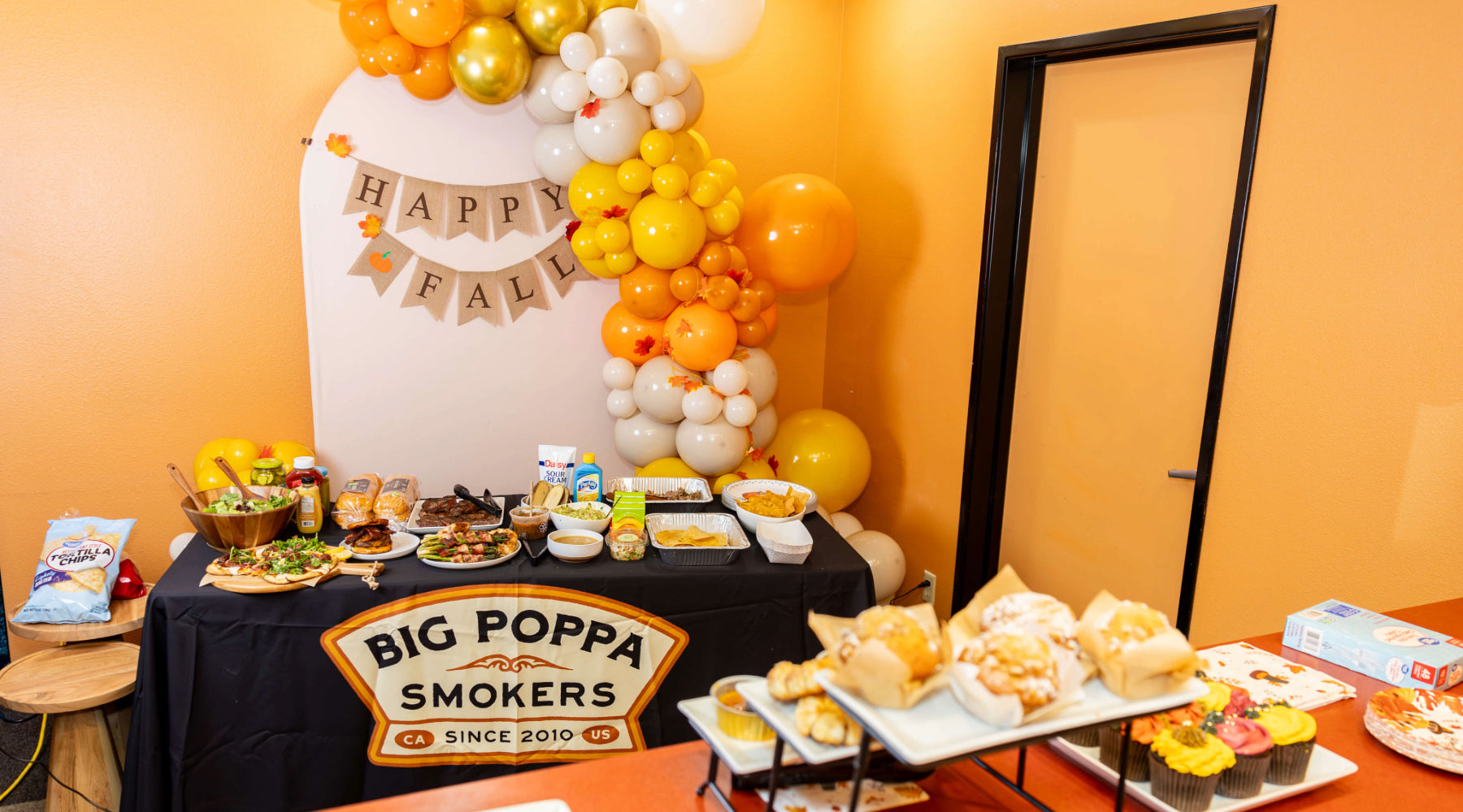 How to BBQ for a large group — Big Poppa Smokers spread of smoked meats, rubs, and sauces for feeding a crowd