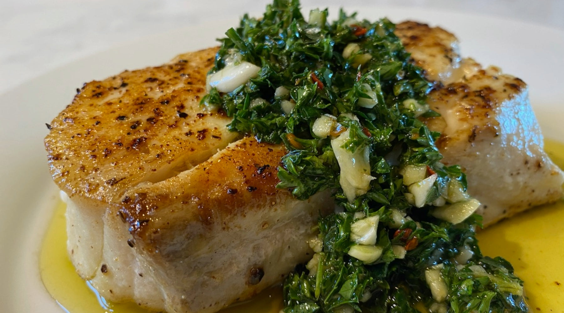 Desert Gold Halibut with chimichurri sauce — grilled on clean grates for a perfect sear