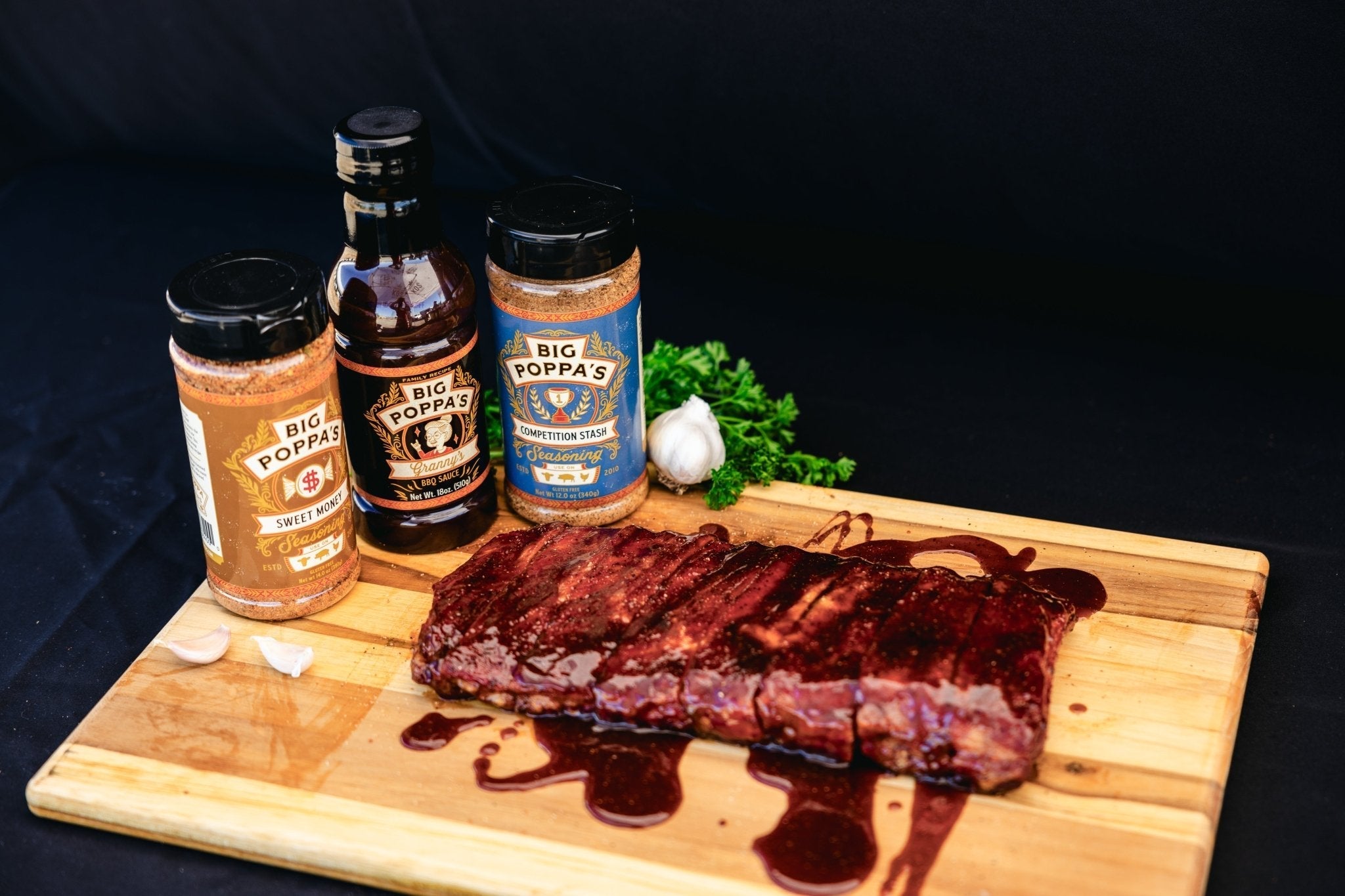 Close-up of Big Poppa's Granny's BBQ Sauce label detailing ingredients and handcrafted design on 1-gallon jug