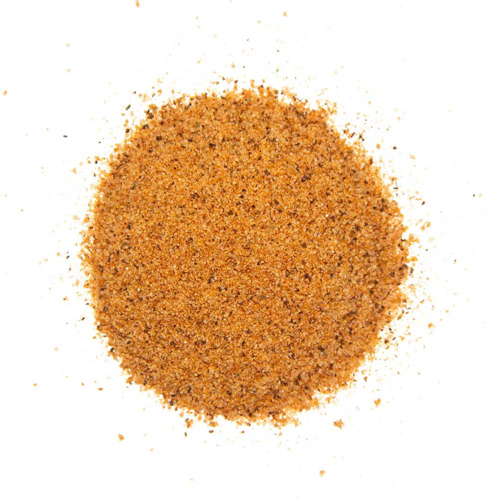 Close-up of the Big Poppa's Happy Ending Finishing Dust seasoning jar showing textured spice mix and detailed label design