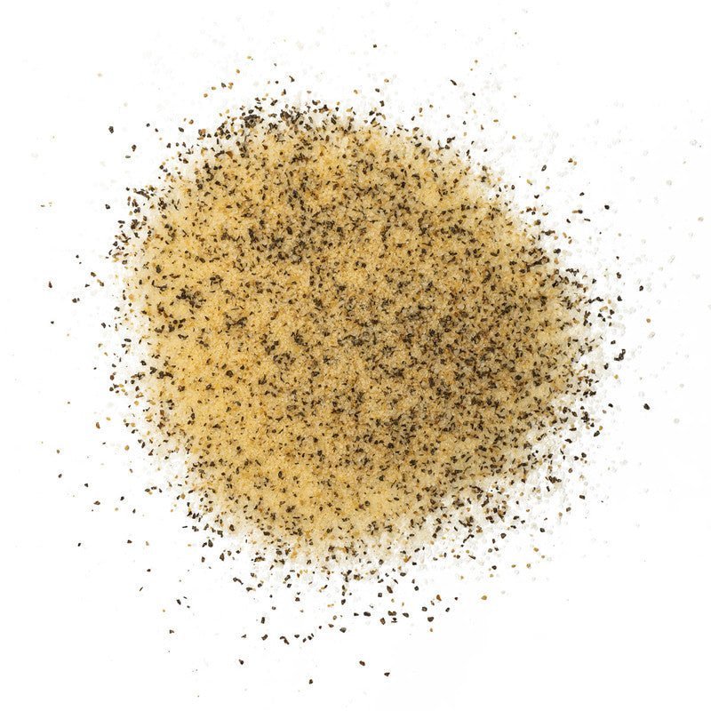 Close-up of the spicy white lightning sauce's textured, creamy surface with visible chili flakes and bold branding label