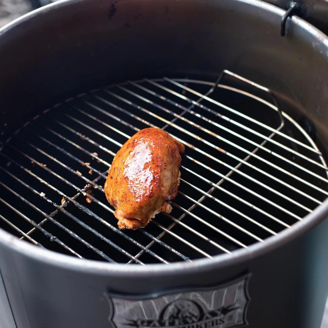 Close-up of the Gateway Mini Go2 Drum Smoker’s textured stainless steel lid handle and latch mechanisms.