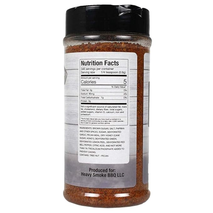 Close-up of the seasoned rub's textured white surface with visible granules and herbal spice flecks, highlighting
