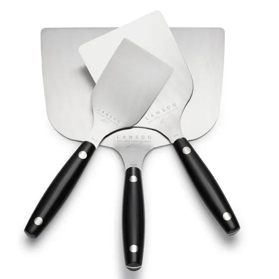 Close-up of the black silicone handle with textured grip and engraved Lamson branding on the edge of the Turner blade.