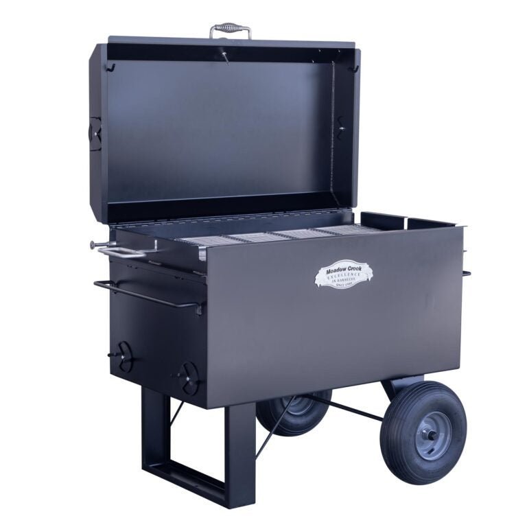 Close-up of the Meadow Creek BBQ42 Chicken Cooker’s welded steel grate with textured surface and built-in handles for