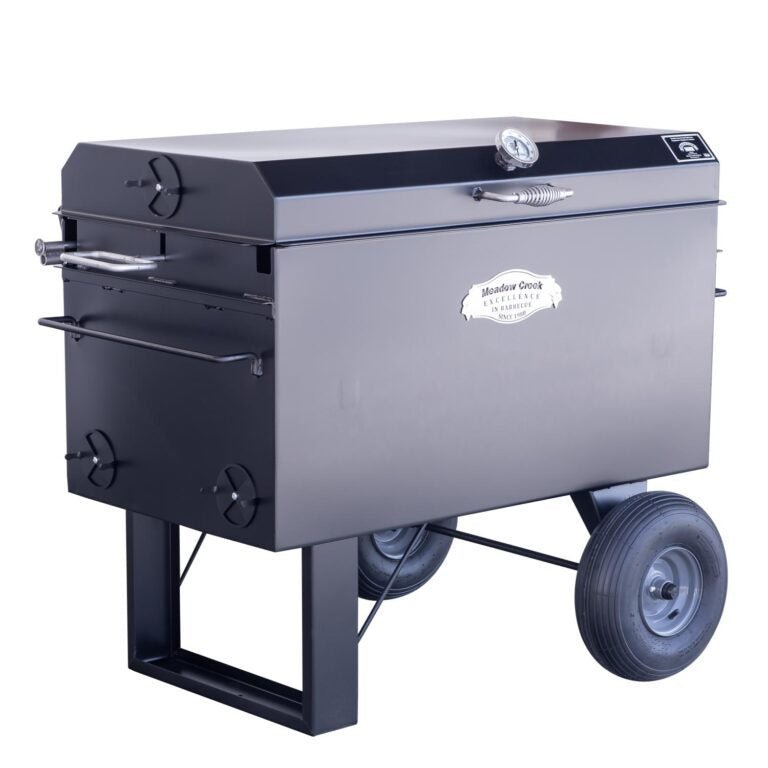 Close-up of the Meadow Creek BBQ42 Chicken Cooker’s textured enamel-coated cooking surface and stainless steel handles