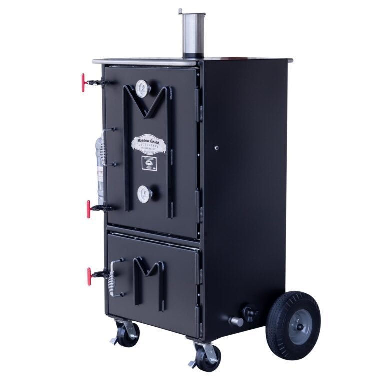 Close-up of the BX50 cabinet smoker’s textured stainless steel handle and latch mechanism on the front panel.