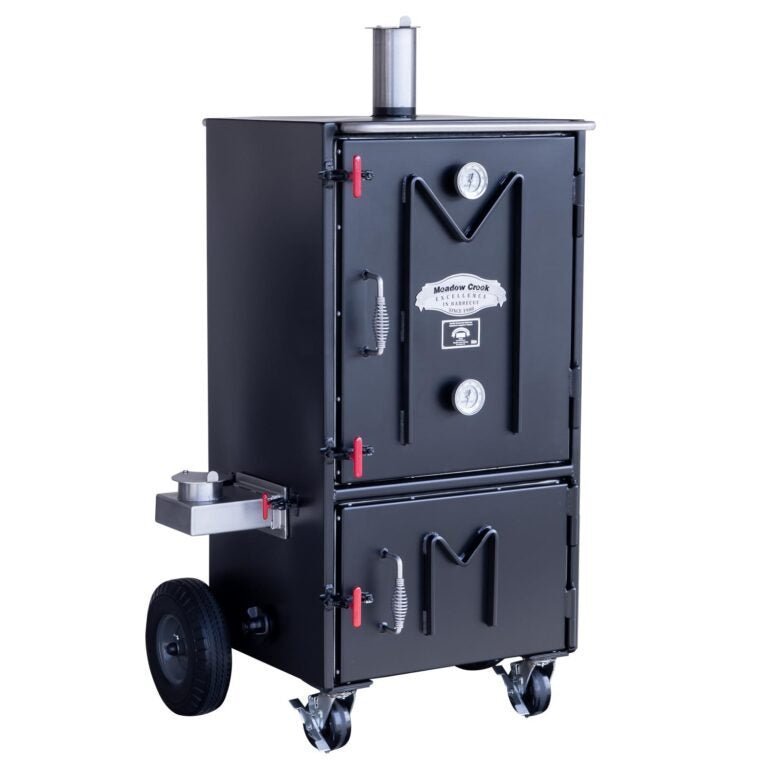 Close-up of the black stainless steel smoker door latch with textured handle and ventilation slots for airflow control.