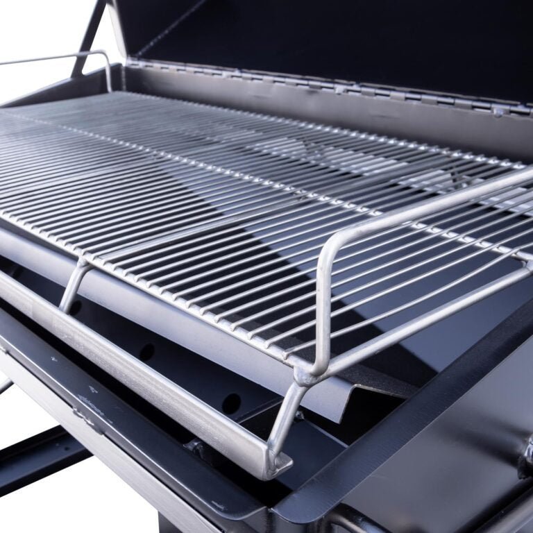 Close-up of the Meadow Creek PR42 pig roaster’s heavy-duty stainless steel construction and textured cooking surface with
