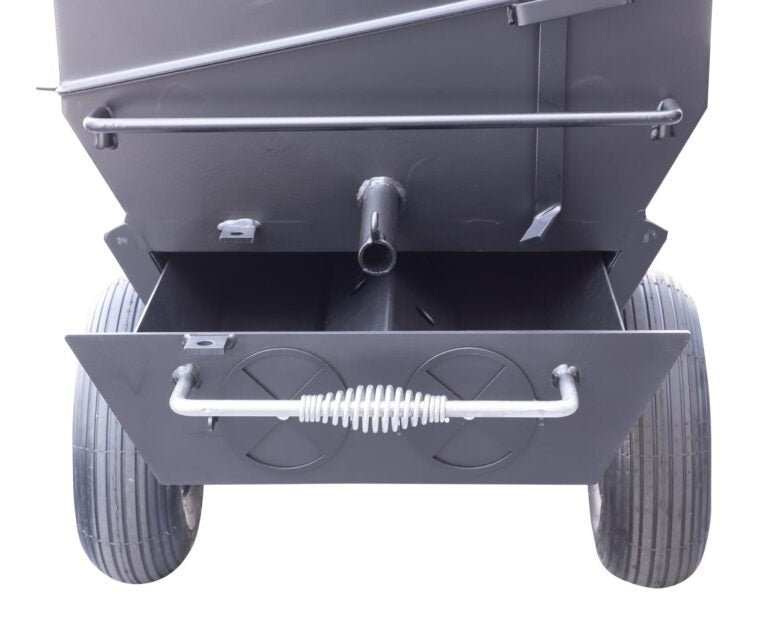 Close-up of the polished stainless steel lid latch and textured locking mechanism on the Meadow Creek PR42 Pig Roaster.