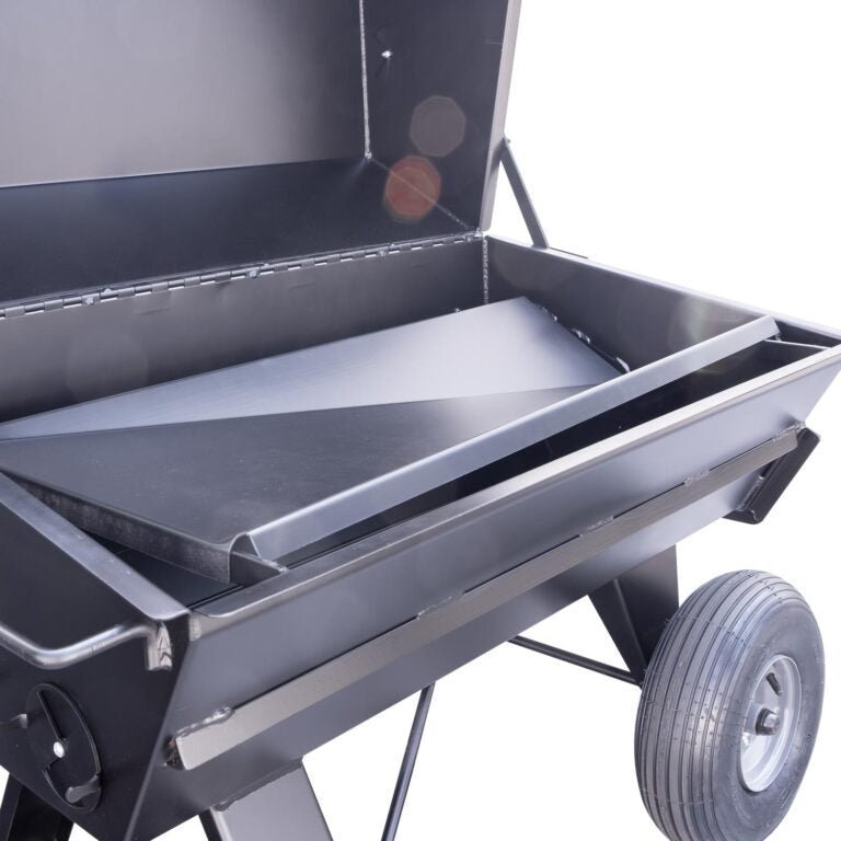 Close-up of the black steel exterior with textured surface and integrated thermometer on the lid of the Meadow Creek PR42