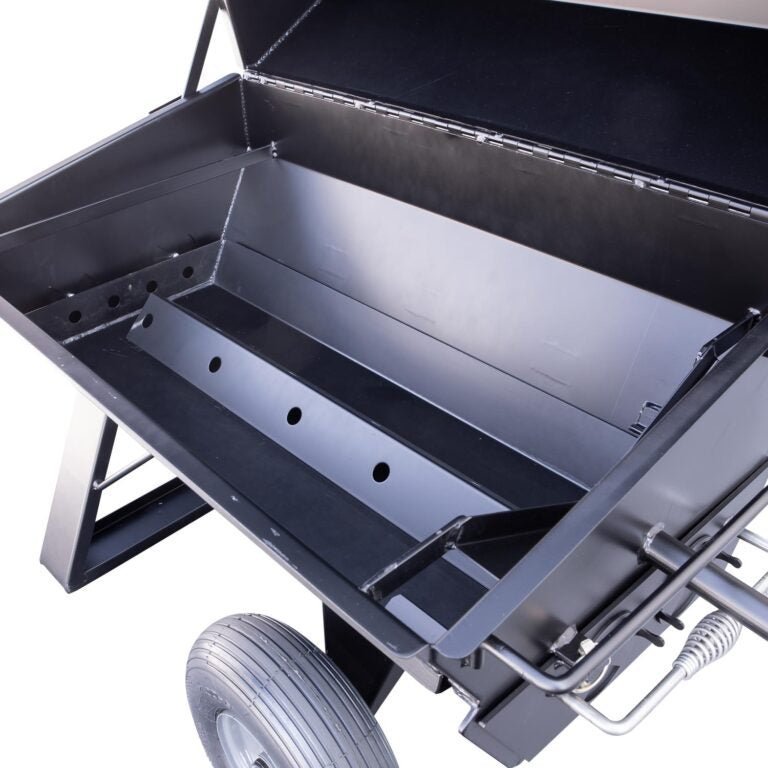 Close-up of the polished stainless steel lid latch and textured handle on the Meadow Creek PR72 Pig Roaster, showing durable