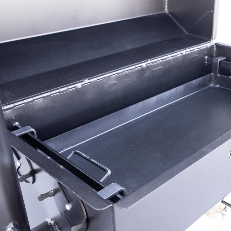 Close-up of the Meadow Creek SQ36 smoker’s textured steel exterior with ventilation slots and matte finish detail
