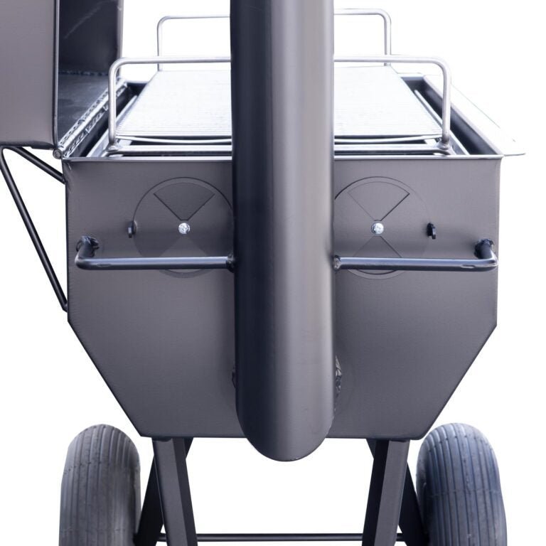 Close-up of black metal air vent with adjustable damper on the side of the SQ36 offset smoker barrel