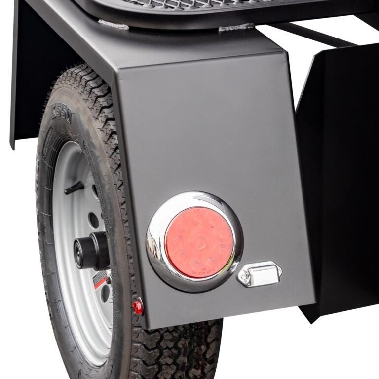 Close-up of the Meadow Creek TS120 smoker’s heavy-duty steel latch and textured black surface at a slight angle