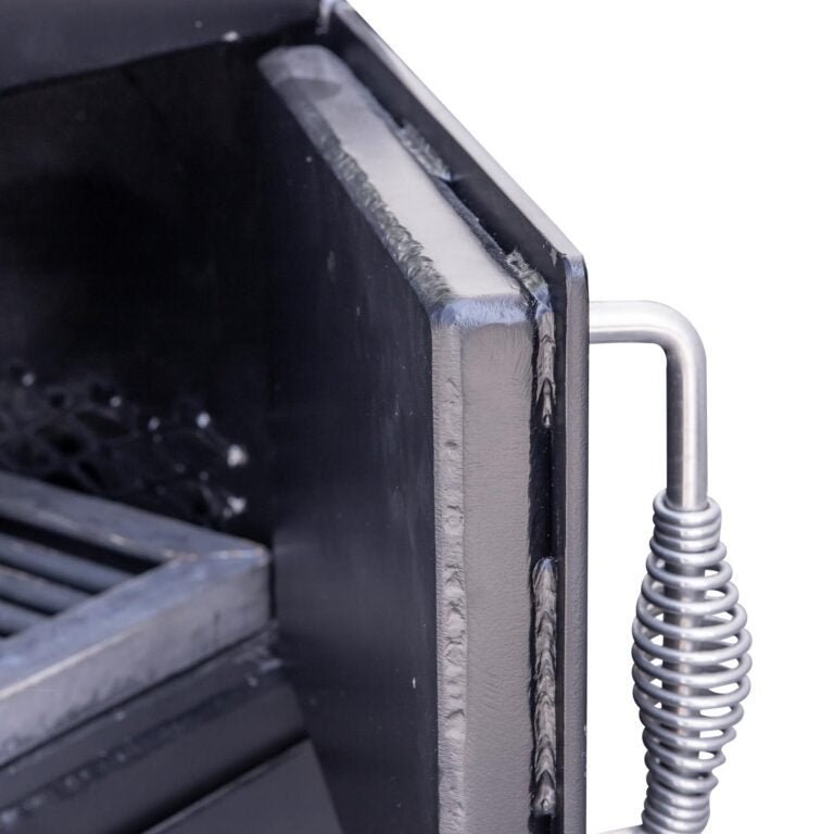 Close-up of the black steel lid latch and textured surface of Meadow Creek TS70P Offset BBQ Smoker showing durable