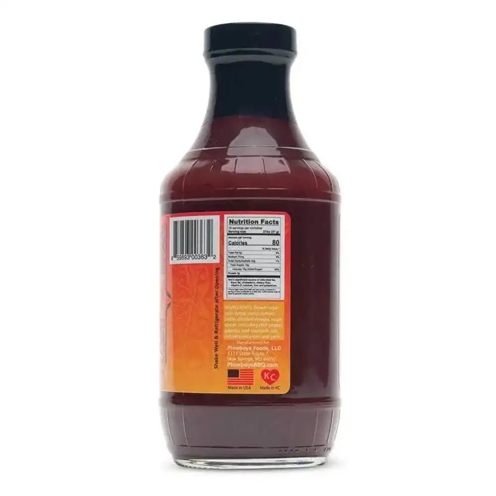 Close-up of the vibrant red Plowboys En Fuego Sauce label highlighting ingredient icons and handcrafted design details